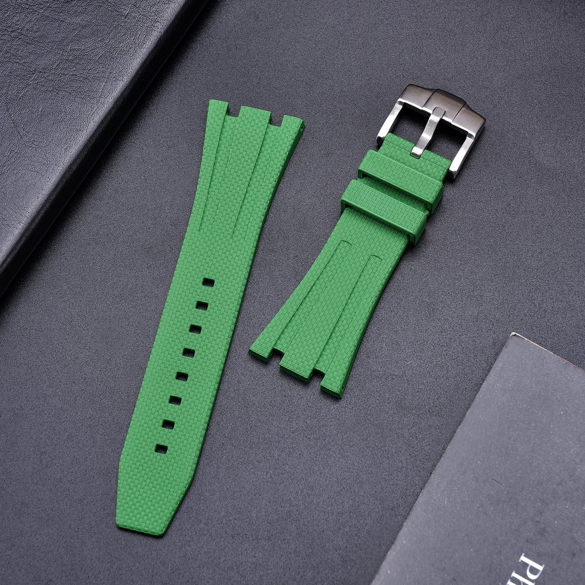 Rubber strap and case for AP x Swatch Green KronoKeeper – strap laid flat on black